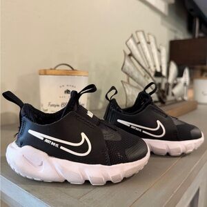 Nike Kids Black Slip-On Sneakers with White Sole and Swoosh